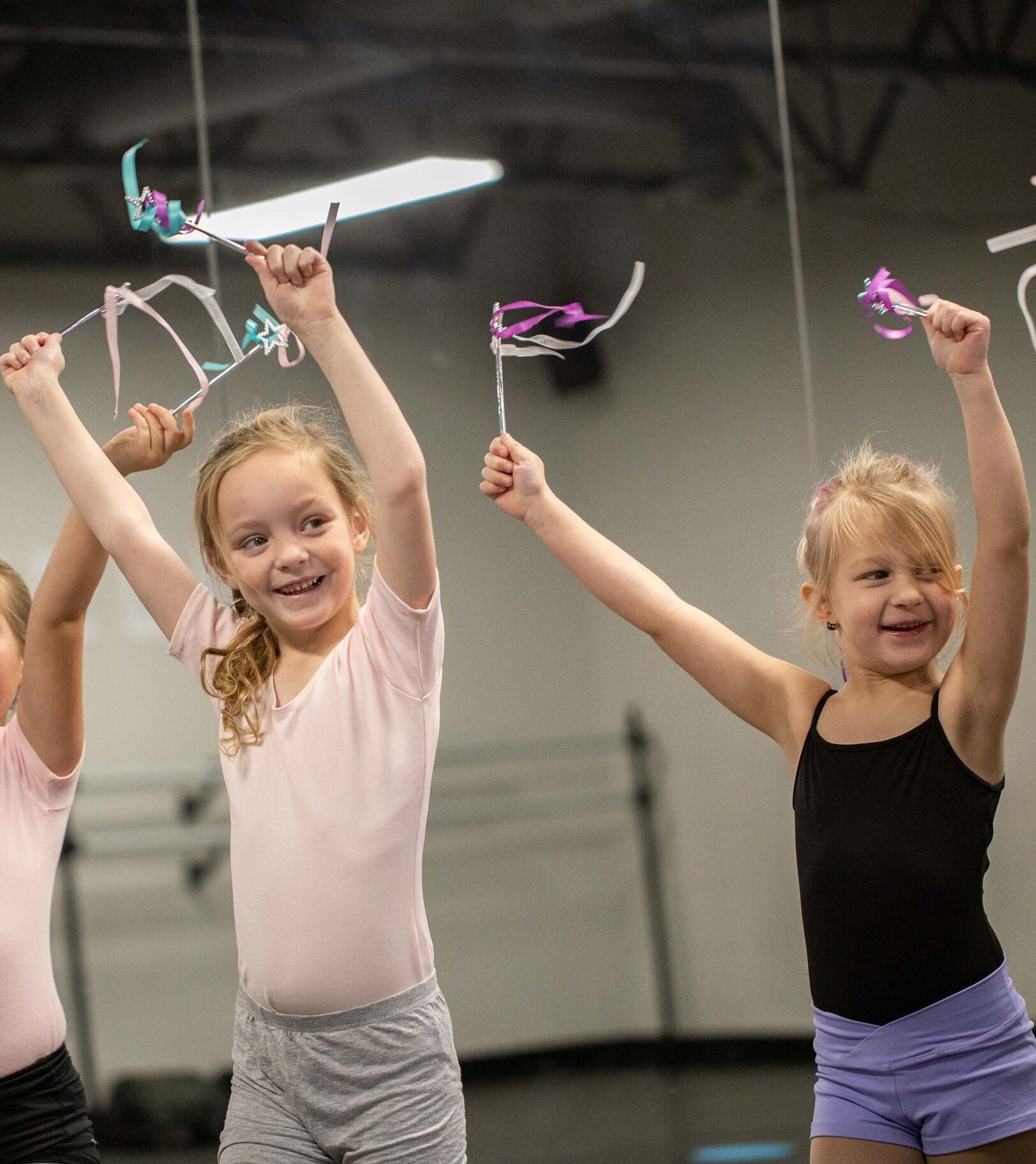 happy girls holding ribbon